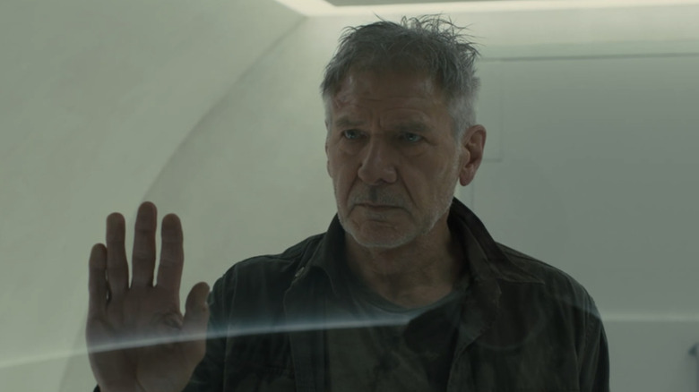 Rick Deckard looking through glass