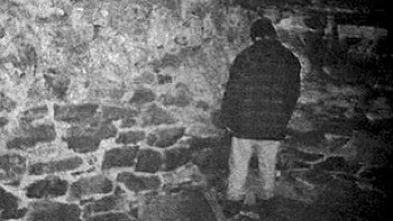 Mike Williams standing in a corner in the basement facing away