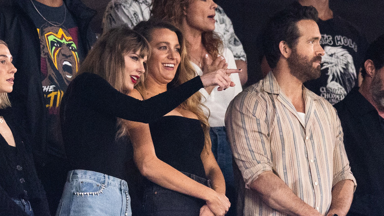 Swift, Lively, and Reynolds at a Chiefs game