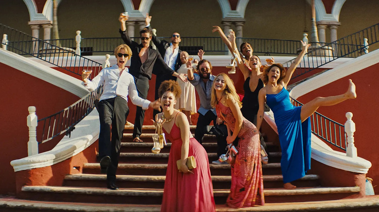 Partiers posing on staircase 