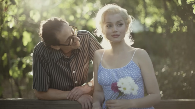 Adrien Brody looking at Ana de Armas