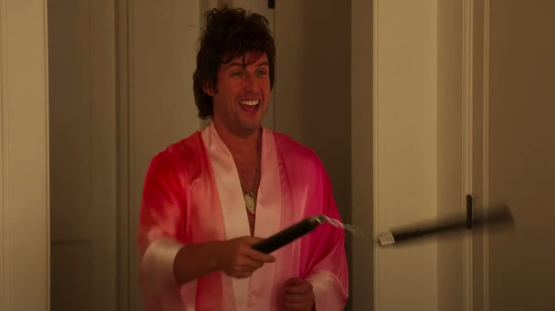 Adam Sandler wielding nunchucks