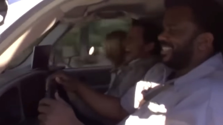 Office cast laughing in car