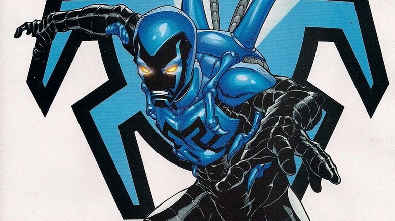 Blue Beetle glowing eyes in front of Scarab