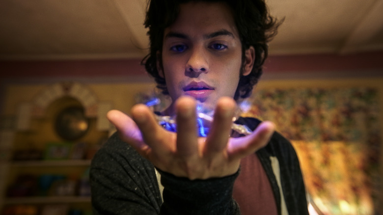 Jaime Reyes holding the scarab