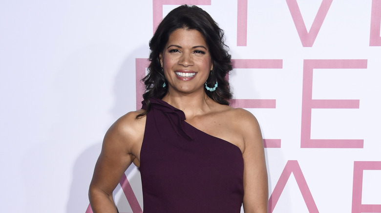 Andrea Navedo wearing purple dress