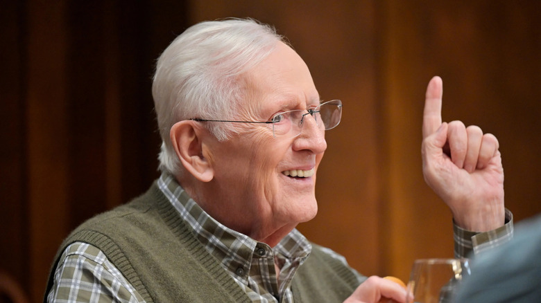 Henry Reagan smiling and pointing