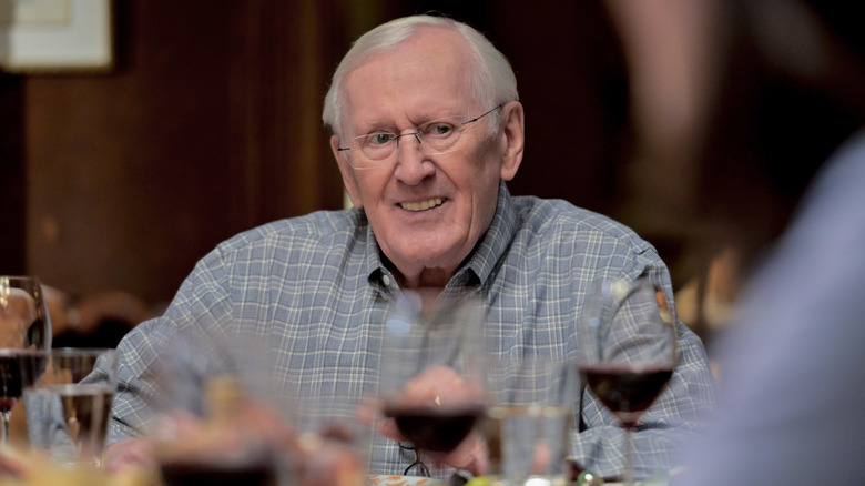 Henry Reagan sitting at dinner