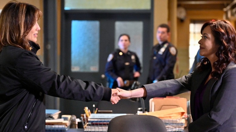 Curatola and Baez shaking hands