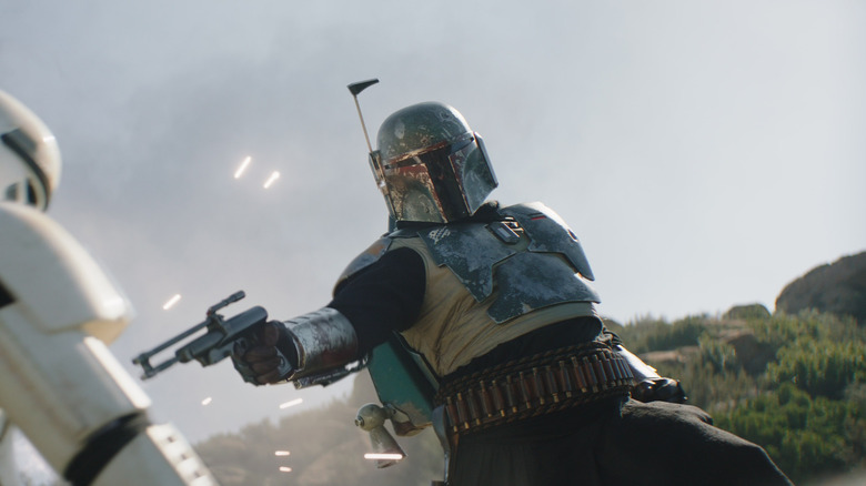 Boba Fett blasts a stormtrooper in season 2 of The Mandalorian