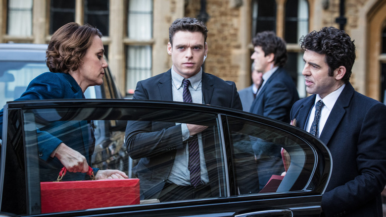 bodyguard David Budd and Julia Montague getting out of car