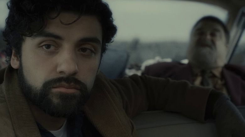 Llewyn Davis and Roland Turner riding in car