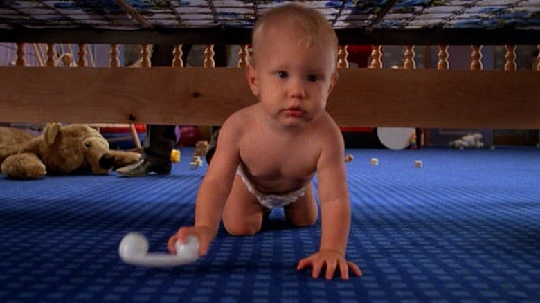 Nathan Jr. crawling under bed 