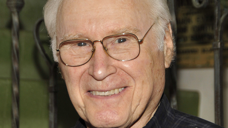 George Coe, in glasses, smiles