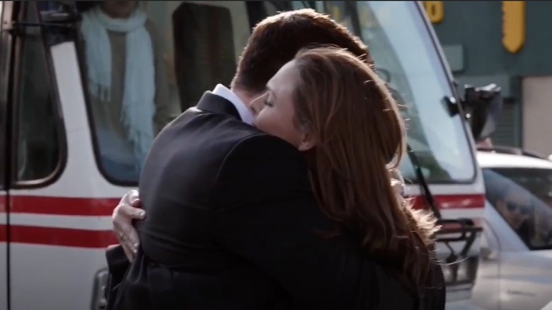 David Borenaz hugging Emily Deschanel