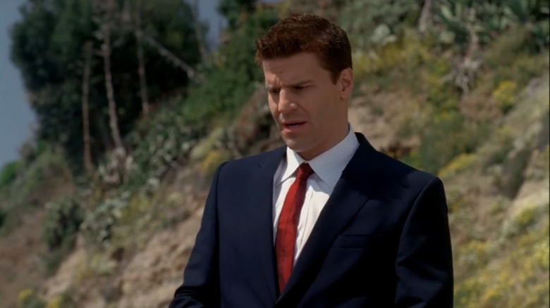 Booth standing at a crime scene