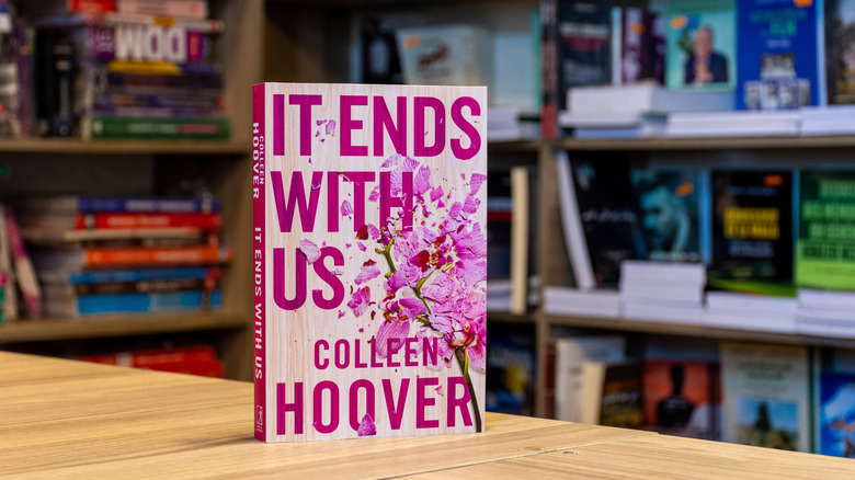 It Ends With Us by Colleen Hoover book standing on table