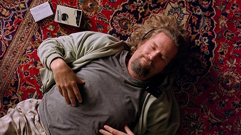 The Dude lies on a rug