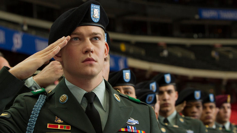 Billy salutes the flag in "Billy Lynn's Long Halftime Walk" (2016)