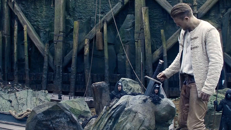 Arthur looks at Excalibur in "King Arthur: Legend of the Sword"