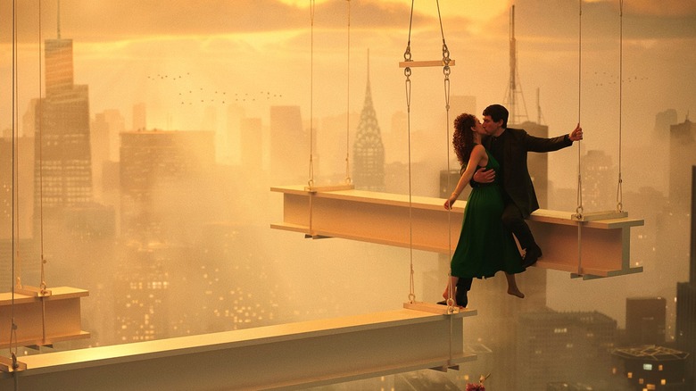 Cesar and Julia kiss on a high rise's girders in "Megalopolis"