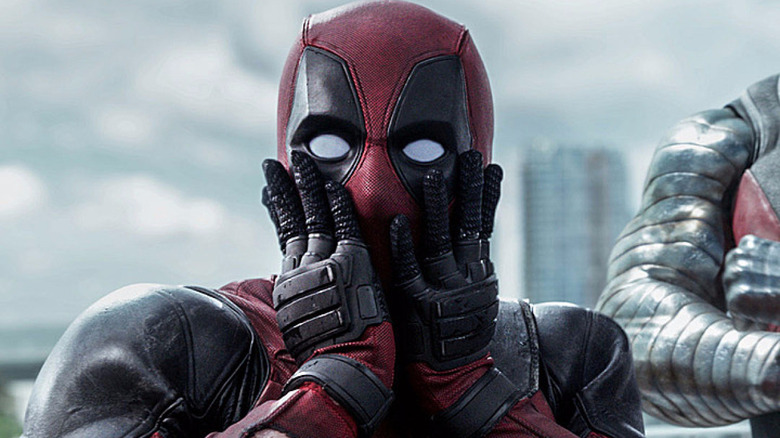 Deadpool putting his hands on his face