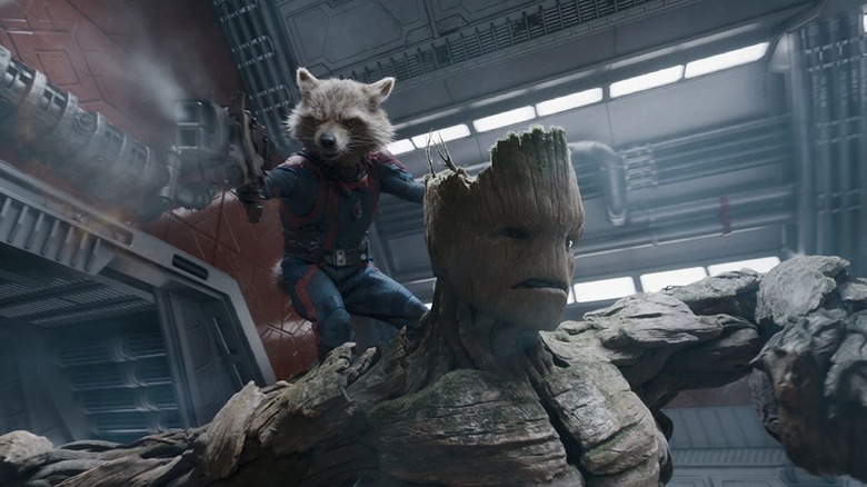 Rocket holding gun on back of Groot