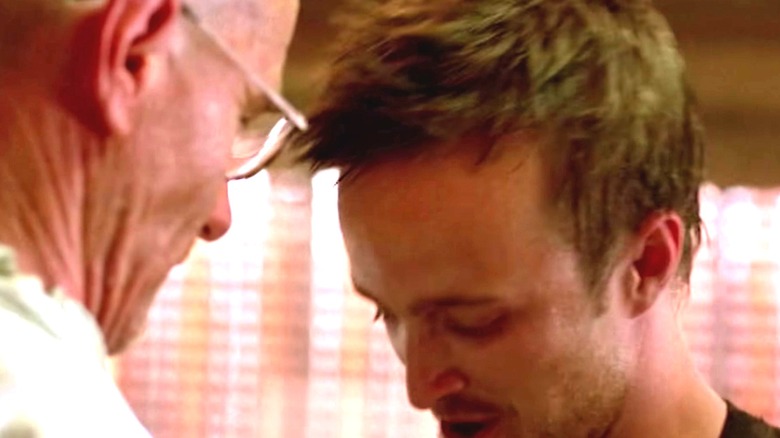 Aaron Paul and Bryan Cranston embracing