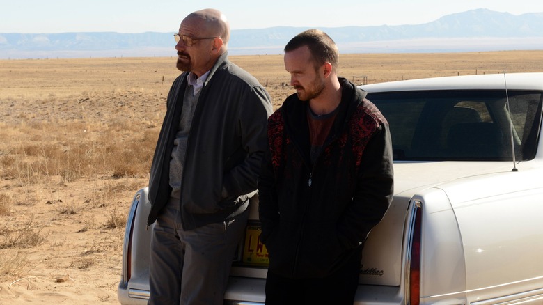 Walt and Jesse leaning on car