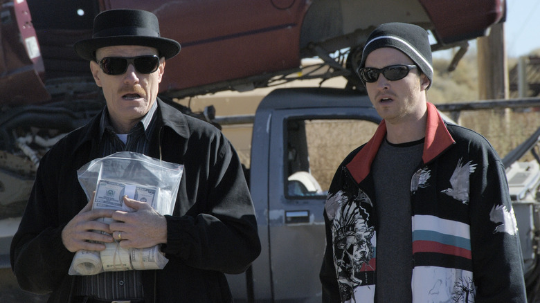 Heisenberg and Jesse baffled with a bag of money