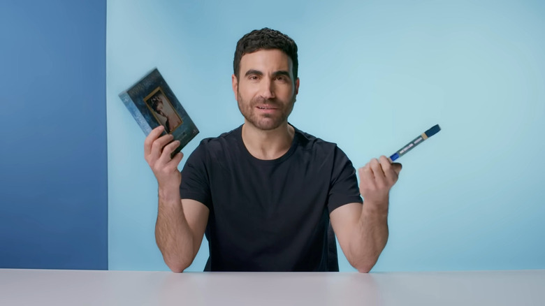 Brett Goldstein holding Blu-Rays