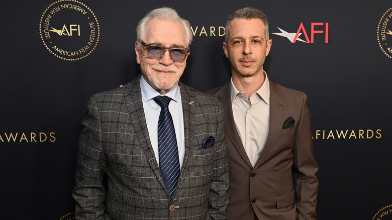 Brian Cox and Jeremy Strong smile