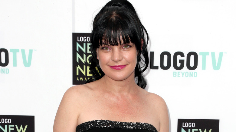 Pauley Perrette smiling for press