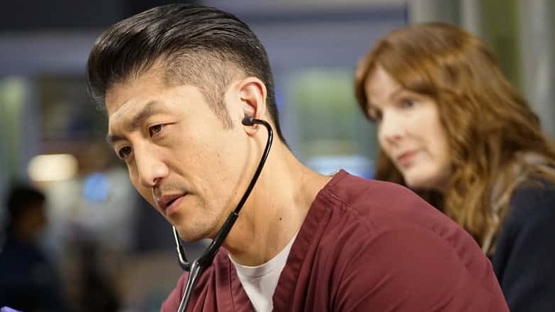 Dr. Choi with a stethoscope in ears