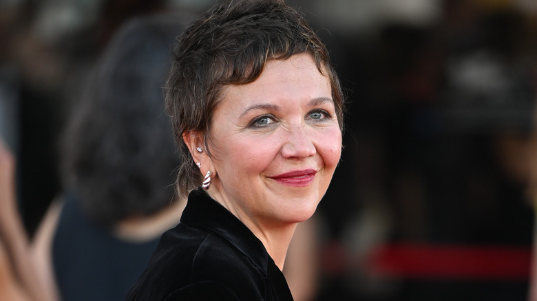 Maggie Gyllenhaal smiles