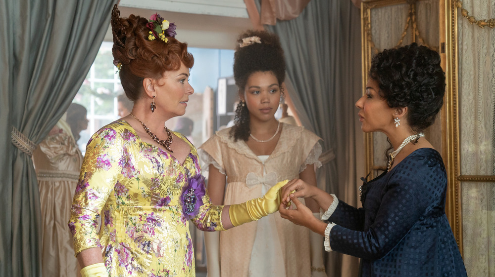 Lady Featherington, Madame Delacroix, and Marina Thompson in the modiste Bridgerton