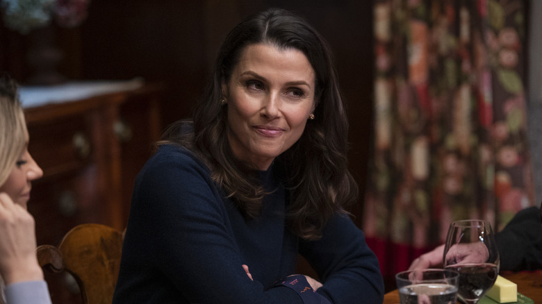 Bridget Moynahan sitting at the dinner table