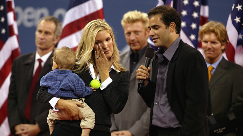 Bridgette Wilson and Pete Sampras speaking on stage