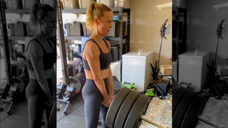 Brie Larson lifting barbell weight