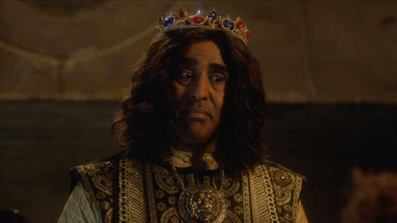 The King wearing a jeweled crown 