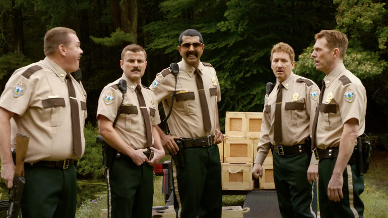 Super Troopers stand in woods