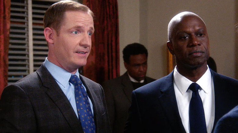 Kevin and Holt in suits