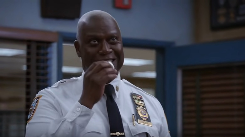 Captain Holt eats marshmallow