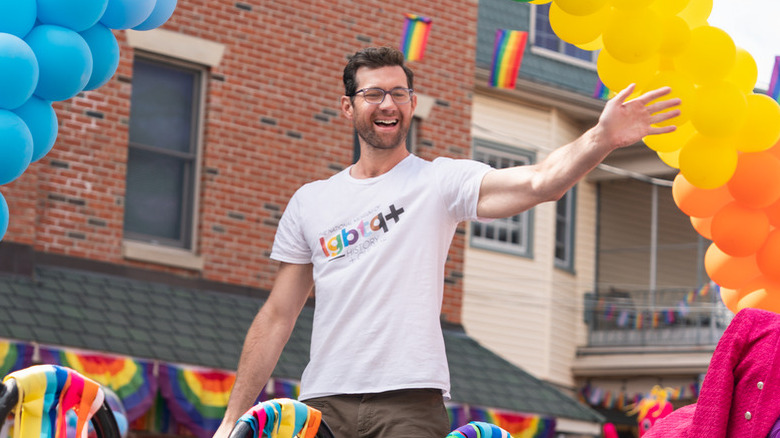 Bobby (Billy Eichner) rides on a pride parade float