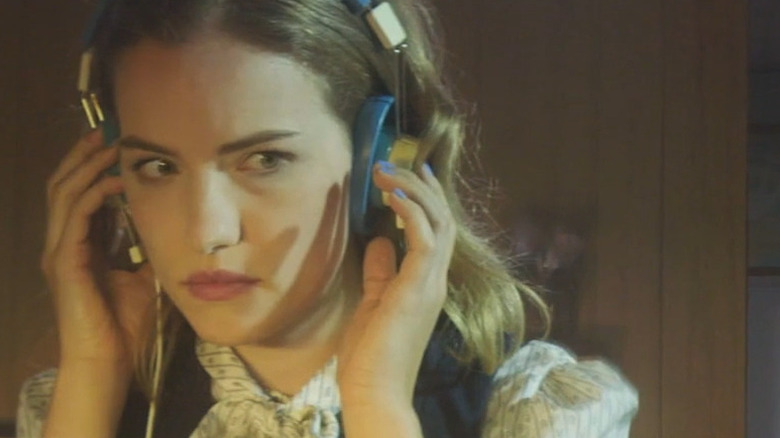 Willa Fitzgerald listens on headphones