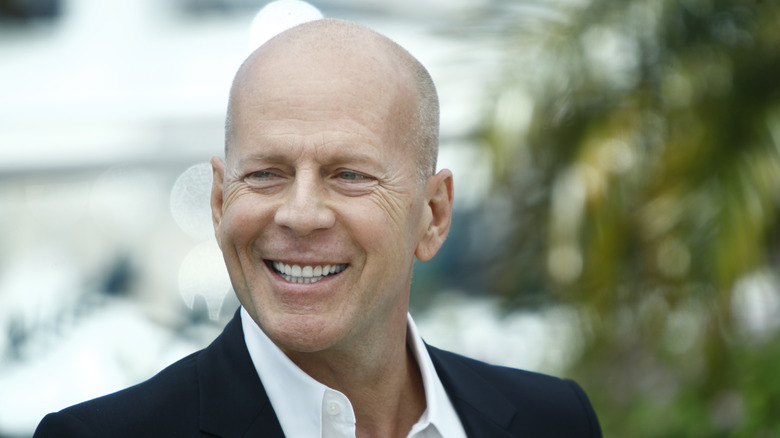 Bruce Willis smiling outside