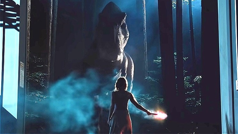 Claire holding a flare for the T. rex