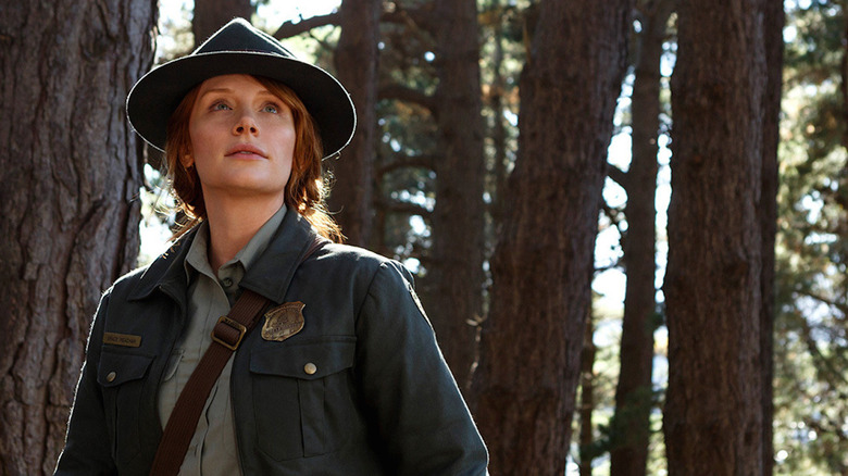 Bryce Dallas Howard searching in forest