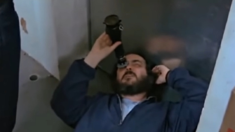 Stanley Kubrick looking up through viewfinder