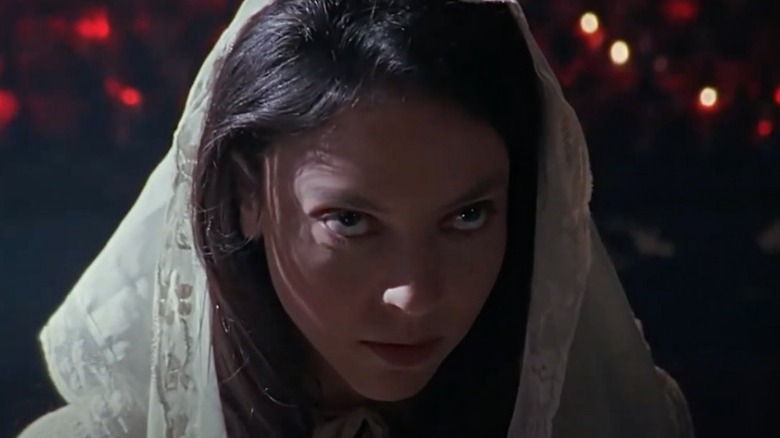 Drusilla crosses herself in church